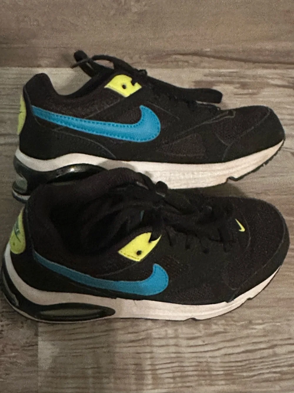 Nike Kids Black Sneakers with Blue Swoosh and Neon Yellow Accents